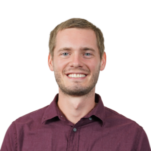 Portrait of a smiling man in burgundy shirt, transparent background.